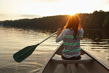 woman paddling on lake